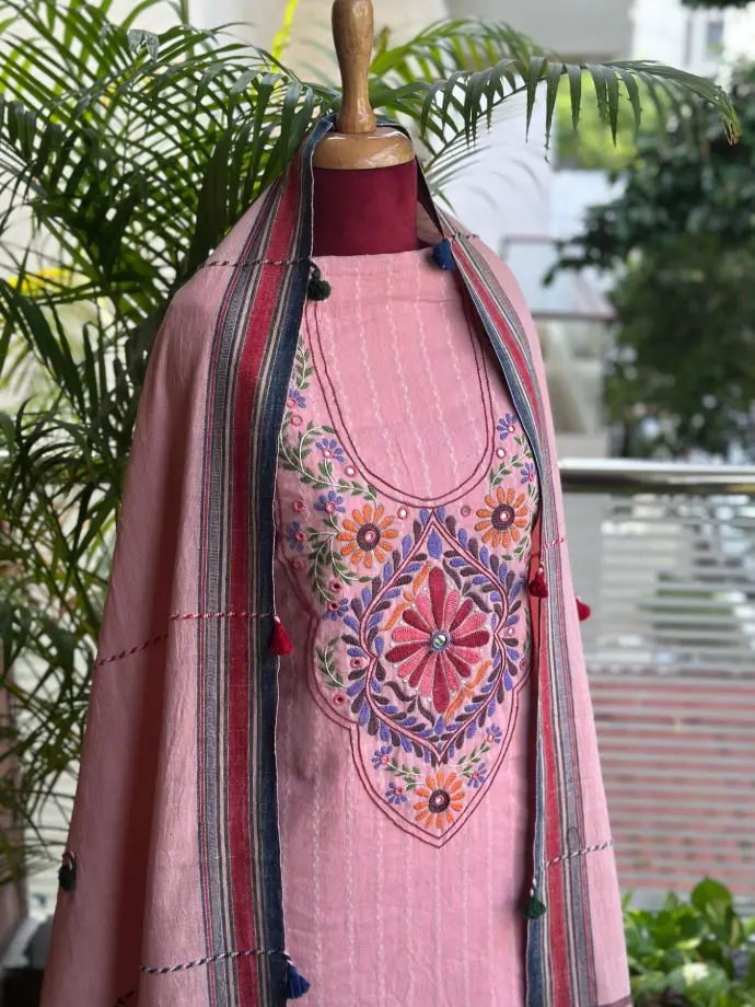 Pink hand-embroidered kurti with traditional floral patterns